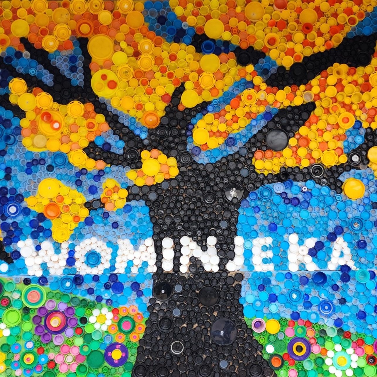 Recycling caps off art installation